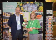 Chad Hartman and Angela Bauer with Truly Good Foods proudly show the Fruit Bowl and Buffalo Nuts products.